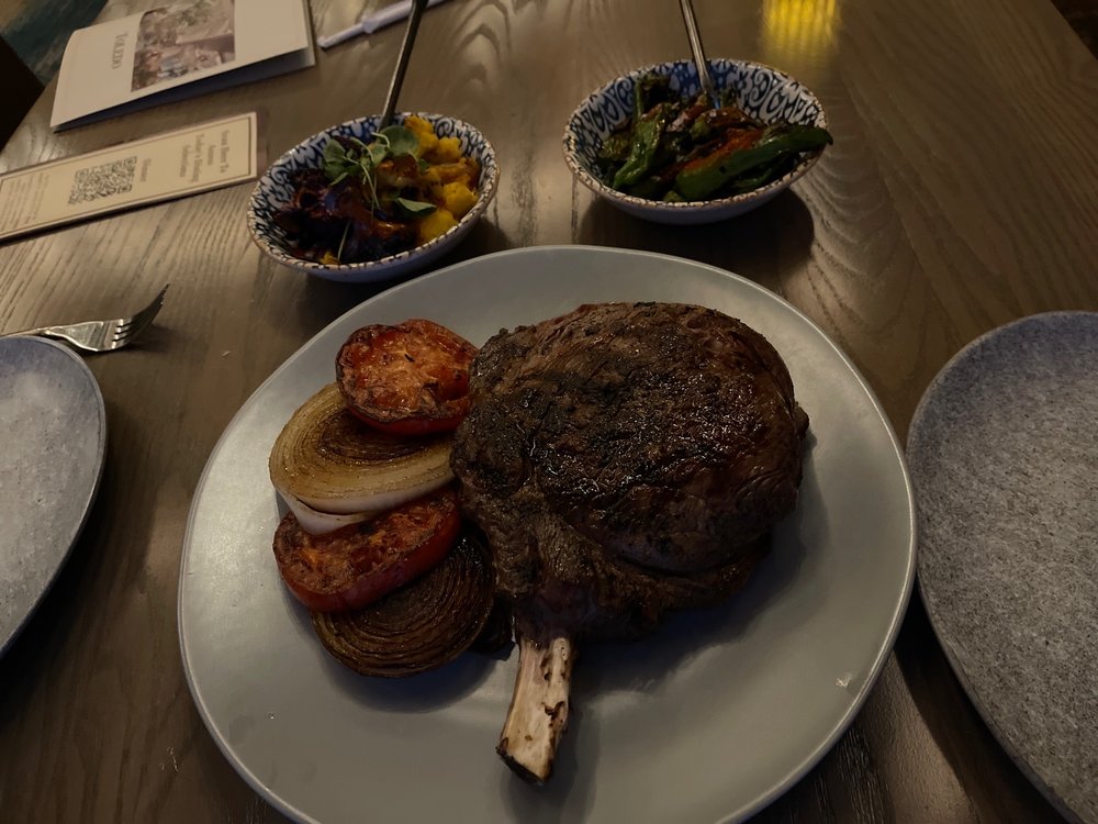 Rib eye, roasted cauliflower, shishito peppers