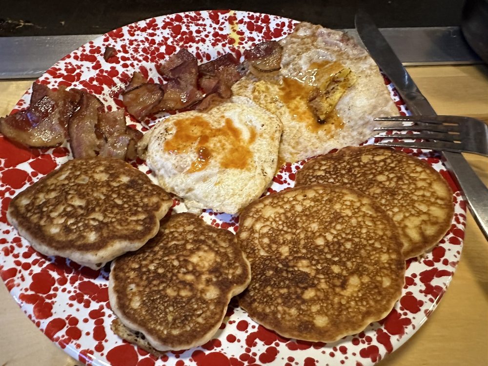 Bacon, eggs, two kinds of pancakes