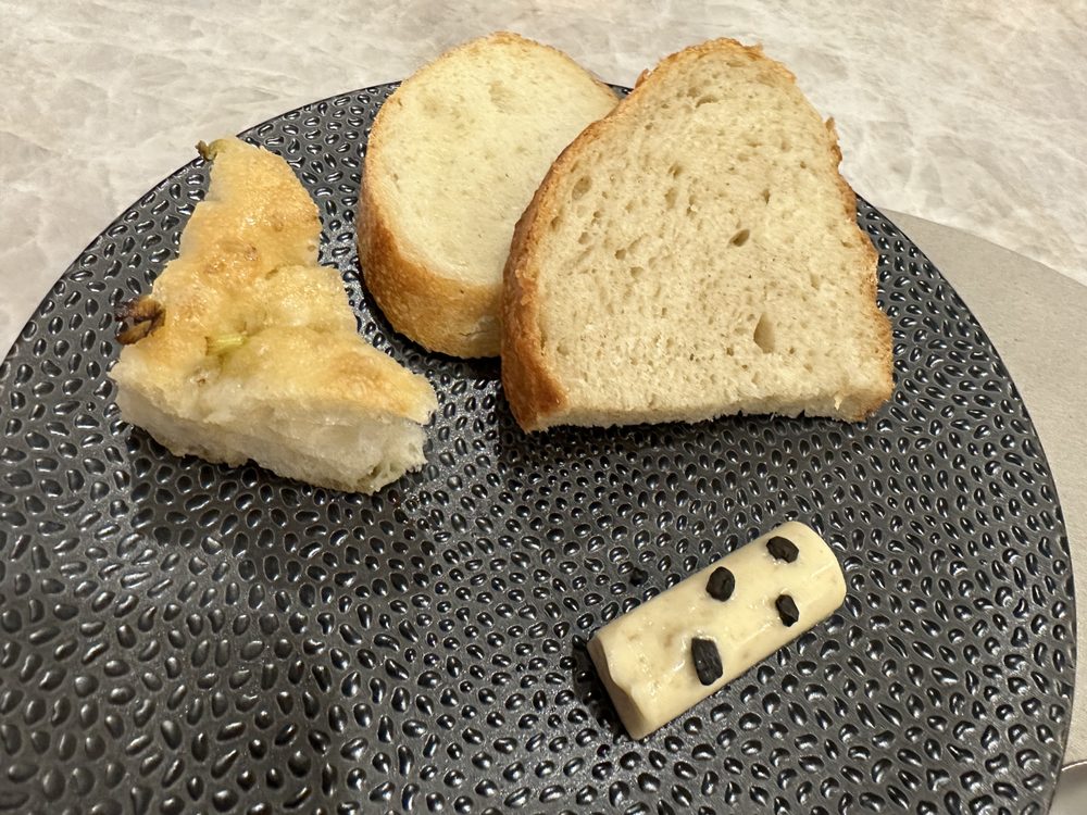 Bread Service: Focaccia, baguette, sour dough, butter with black salt